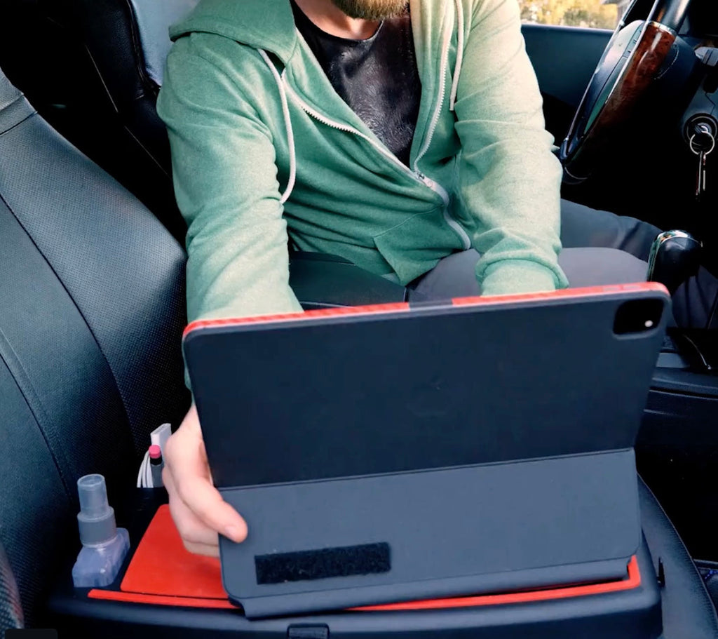 Stupid Car Tray supporting a tablet on a passenger seat