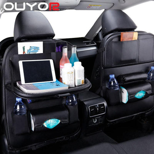 Black car backseat organizer with storage pockets and fold-down tray