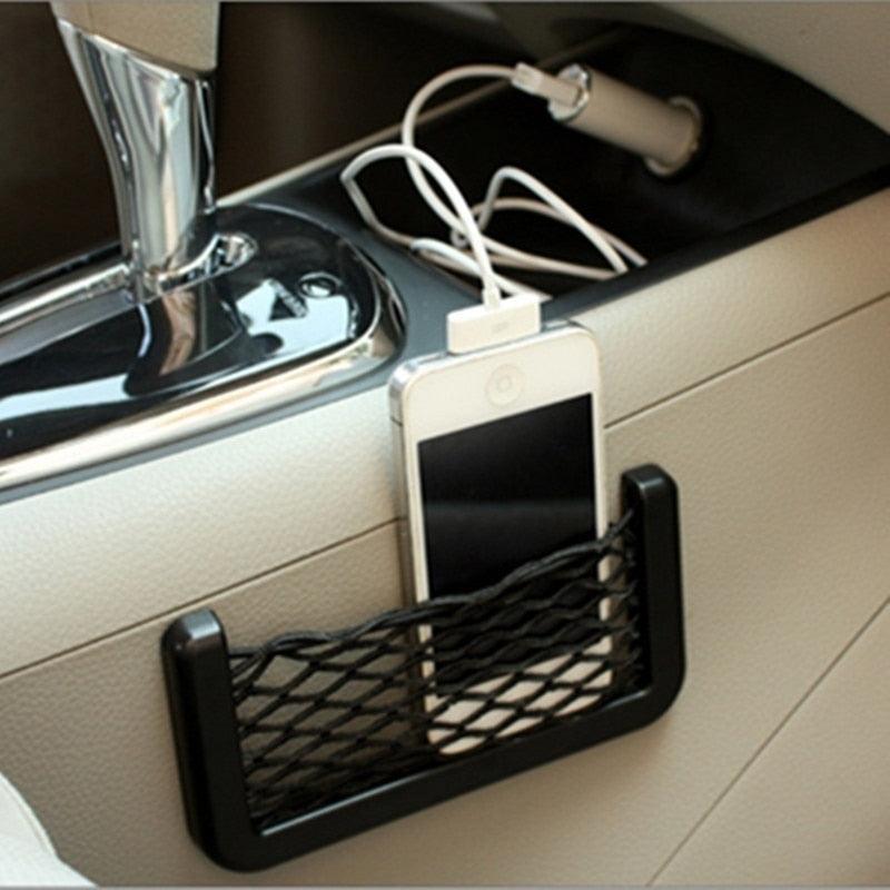 Black car seat side storage net pocket installed beside a seat